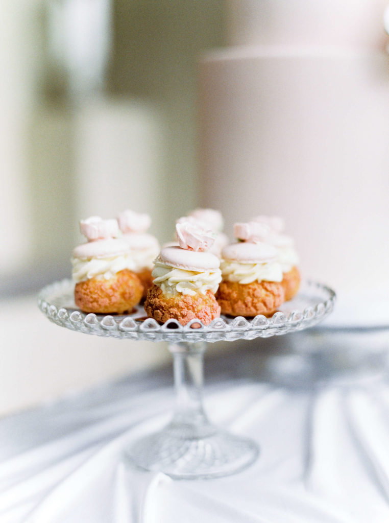 Blush wedding profiterole and macaron dessert table